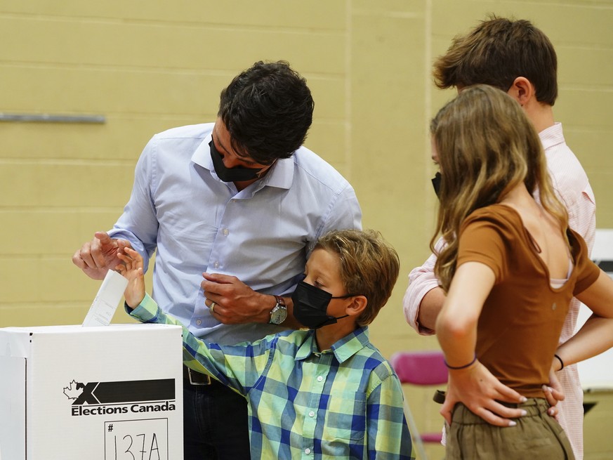 Liberal leader Justin Trudeau casts his ballot in the 44th general federal election as he&#039;s joined by his children, Xavier, Ella-Grace and Hadrien in Montreal on Monday, Sept. 20, 2021. (Sean Kil ...