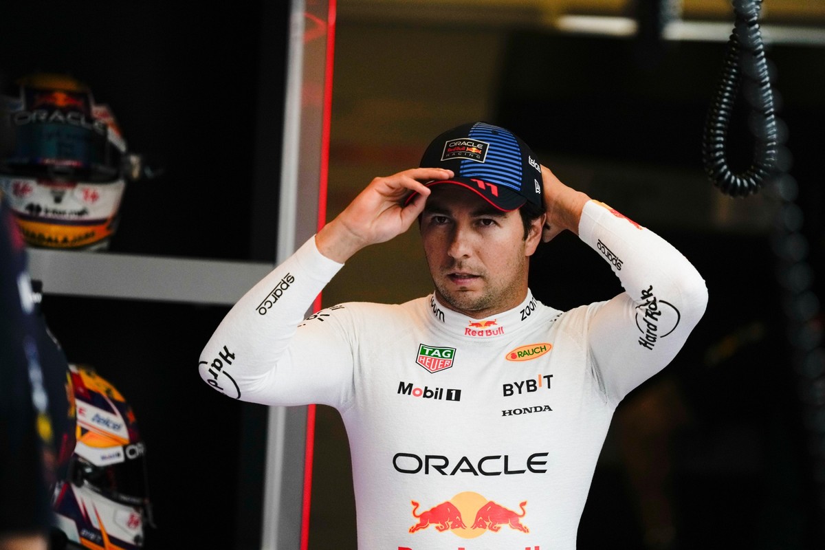 FILE - Red Bull driver Sergio Perez, of Mexico, arrives for the practice ahead of the Formula One Abu Dhabi Grand Prix at the Yas Marina Circuit in Abu Dhabi, UAE, Dec. 6, 2024. (AP Photo/Altaf Qadri, ...