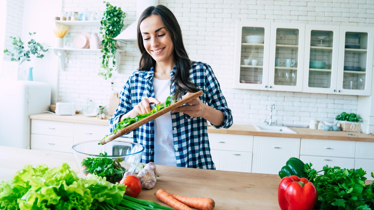 Healthy Food. Vegan Salad. Diet. Dieting Concept. Healthy Lifestyle. Cooking At Home. Prepare Food. Cutting ingredients on table