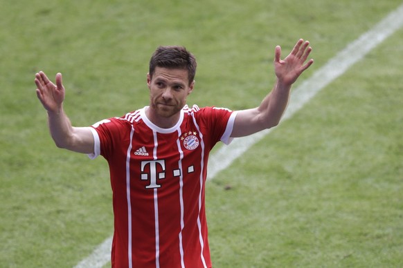 FILE - Bayern&#039;s Xabi Alonso waves to supporters as he leaves the field during the German first division Bundesliga soccer match between FC Bayern Munich and SC Freiburg at the Allianz Arena stadi ...