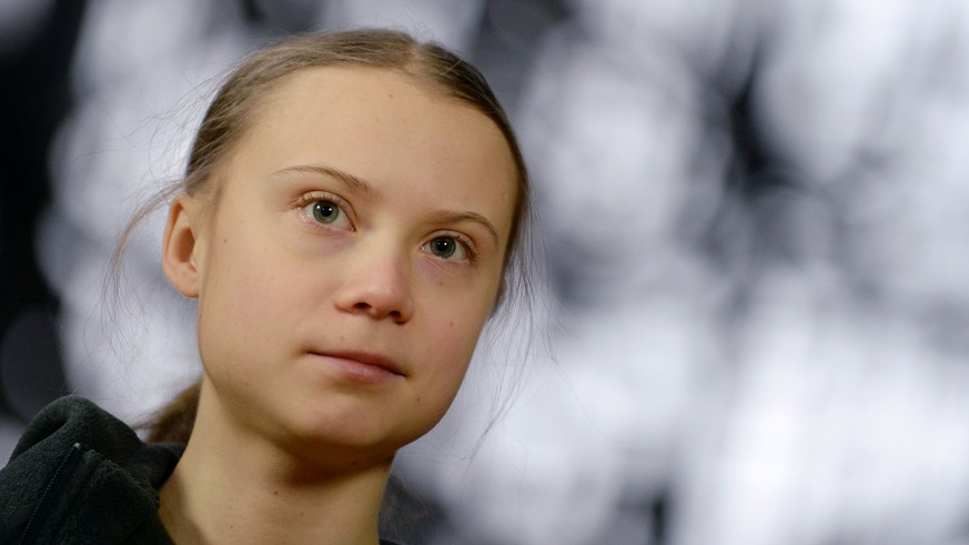FILE PHOTO: Swedish climate activist Greta Thunberg talks to the media before meeting with EU environment ministers in Brussels, Belgium, March 5, 2020. REUTERS/Johanna Geron/File Photo