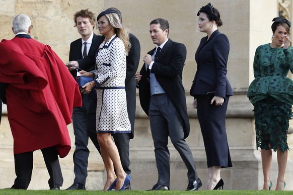 Kate Moss, third left, and Liv Tyler, second right, arrive for the wedding of Princess Eugenie of York and Jack Brooksbank at St George’s Chapel, Windsor Castle, near London, England, Friday Oct. 12,  ...