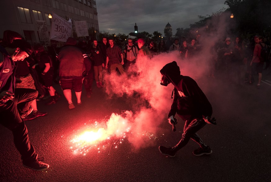 Anti-G7 protesters demonstrate ahead of the G7 Summit in Quebec City, Thursday, June 7, 2018. (Darren Calabrese/The Canadian Press via AP)