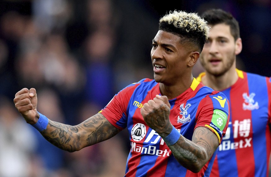 Crystal Palace's Patrick van Aanholt celebrates scoring his side's fourth goal of the game during their English Premier League soccer match Leicester City at Selhurst Park, London, Saturday, April 28, ...