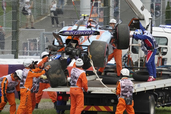 The car of Williams driver Logan Sargeant of the US is lifted after a crash during qualifying session for the Japanese Formula One Grand Prix at the Suzuka Circuit, Suzuka, central Japan, Saturday, Se ...