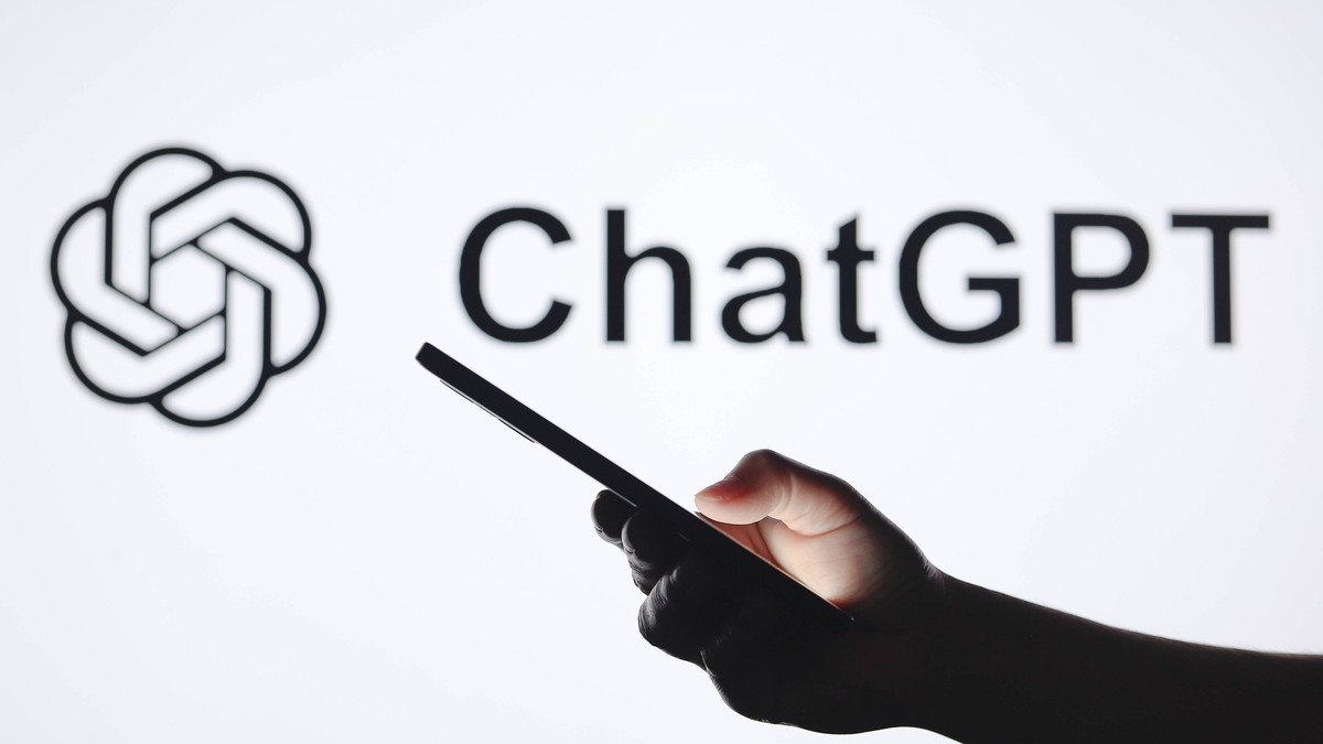 Logos displayed on smartphones in Paraguay - 05 Sept 2024 In this photo illustration, the ChatGPT logo seen in the background with a silhouette hand holding a smartphone. Paraguay Copyright: xJaquexSi ...
