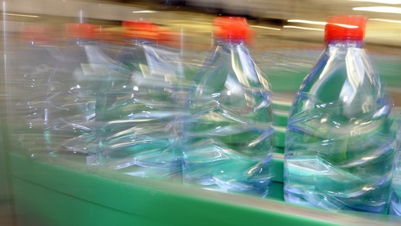 France, Vittel, mineral water bottling plant of Nestle Waters Supply, bottles on a production line |