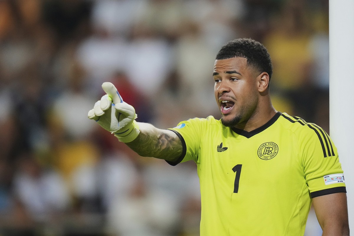 Germany's goalkeeper Noah Atubolu gives instructions to his players during a quarter final soccer match between Germany and Italy at the European U-21 Championship at the DAC Arena in Dunajska St ...