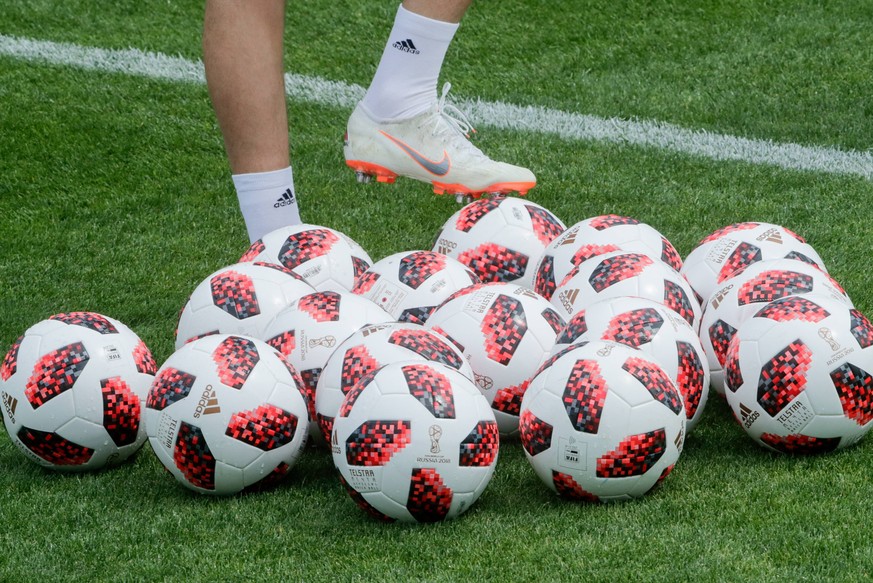 MOSCOW REGION, RUSSIA - JUNE 30, 2018: The Telstar Mechta, the official match balls for the khockout stages of the 2018 FIFA World Cup WM Weltmeisterschaft Fussball during a training session by the Ru ...