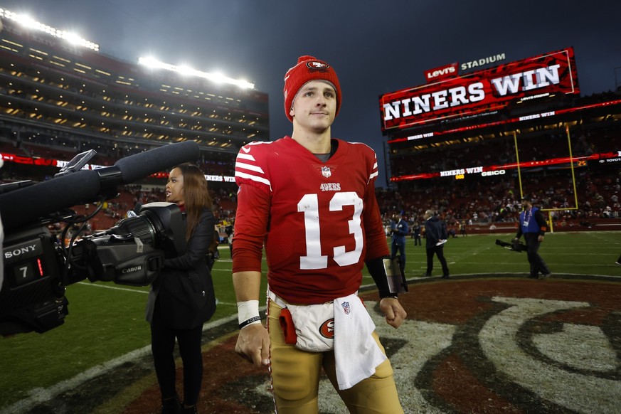 San Francisco 49ers quarterback Brock Purdy (13) walks on the field after an NFL wild card playoff football game against the Seattle Seahawks in Santa Clara, Calif., Saturday, Jan. 14, 2023. The 49ers ...