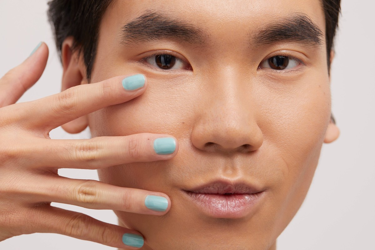 Studio portrait of handsome man with colored nails model released Copyright: xCulturaxCreativex