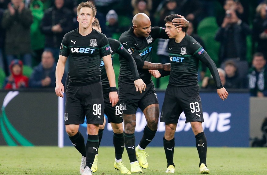 KRASNODAR, RUSSIA - NOVEMBER 8, 2018: FC Krasnodar s Sergei Petrov (L), Ari (C), and Magomed Shapi Suleimanov celebrate a goal in the 2018/19 UEFA Europa League Group J football match between FC Krasn ...