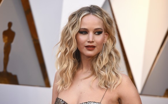 FILE - In this March 4, 2018 file photo, Jennifer Lawrence arrives at the Oscars at the Dolby Theatre in Los Angeles. A Connecticut man is asking for leniency while facing sentencing for hacking into  ...