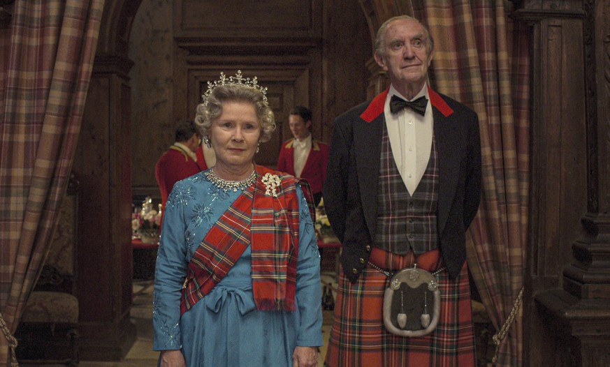 This image released by Netflix shows Imelda Staunton as Queen Elizabeth II, left, and Jonathan Pryce as Prince Phillip in a scene from &quot;The Crown.&quot; (Netflix via AP)