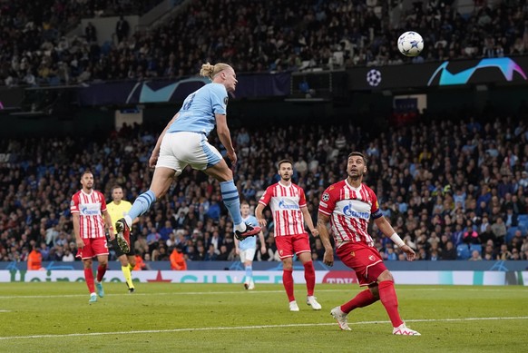 MANCHESTER, ENGLAND, 19th September 2023. Erling Haaland of Manchester City heads against the crossbar during the UEFA Champions League match at the Etihad Stadium, Manchester. Picture credit should r ...