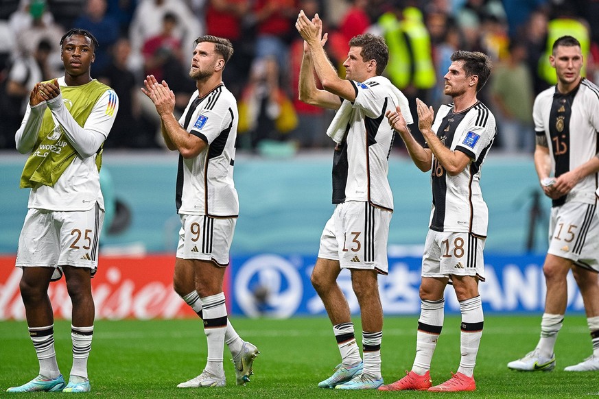 AL KHOR, QATAR - NOVEMBER 28: Armel Bella Kotchap of Germany, Niclas Fullkrug of Germany, Jonas Hofmann of Germany and Thomas Muller of Germany applauds for the fans after the Group E - FIFA World Cup ...