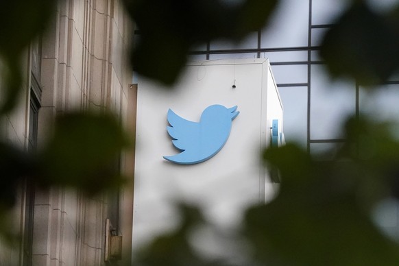 FILE - A sign at Twitter headquarters is shown in San Francisco, Thursday, Dec. 8, 2022. Twitter has suspended an account that used publicly available flight data to track Elon Musk's private jet, des ...