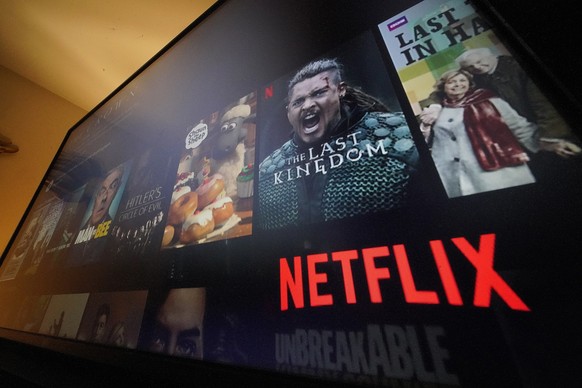 The Netflix menu is shown on a screen in Pittsburgh, on Monday, Oct. 17, 2022. Netflix posted its third quarter results a few weeks before the company launches a cheaper version of its video streaming ...