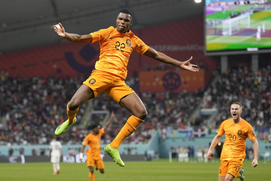 Denzel Dumfries of the Netherlands celebrates scoring his side's 3rd goal during the World Cup round of 16 soccer match between the Netherlands and the United States, at the Khalifa International Stad ...