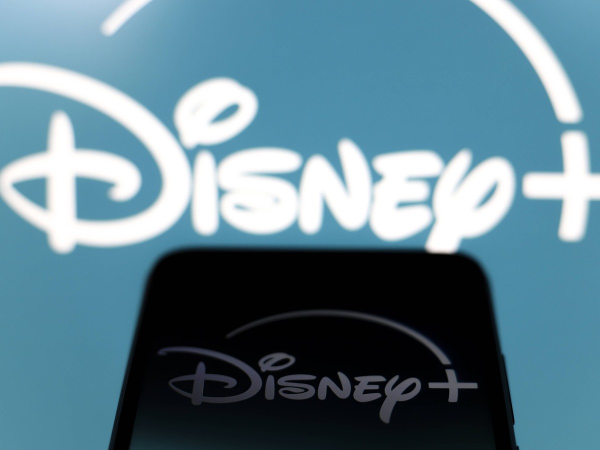 Streaming Video Apps The Disney Plus logo appears on the screen of a smartphone and in the background on the computer screen in Reno, United States, on December 15, 2024. Reno United States PUBLICATIO ...