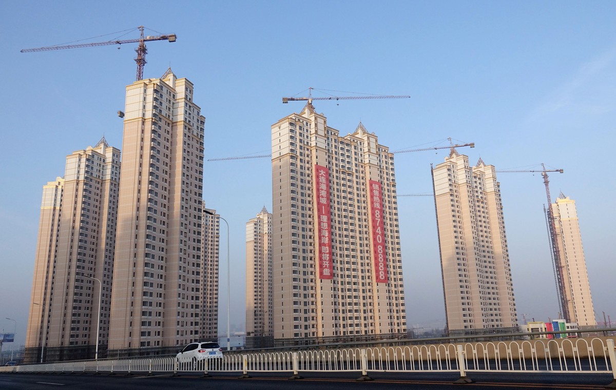 FILE PHOTO: Residential buildings under construction are seen in Jinpu New District in Dalian, Liaoning province, China March 19, 2018. China Daily via REUTERS/File Photo ATTENTION EDITORS - THIS IMAG ...