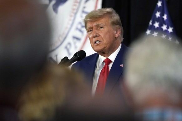 Former President Donald Trump visits with campaign volunteers at the Elks Lodge, Tuesday, July 18, 2023, in Cedar Rapids, Iowa. (AP Photo/Charlie Neibergall)