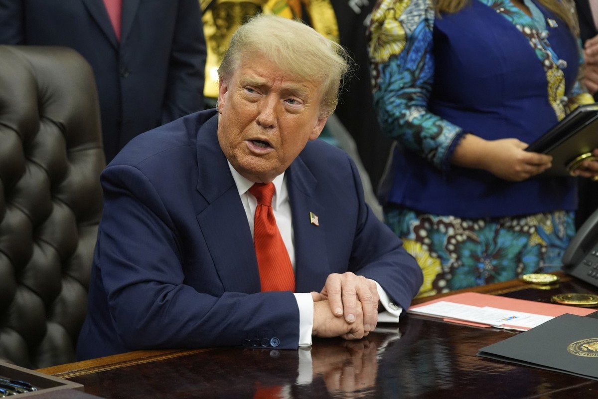 President Donald Trump answers questions from reporters as he meets with Congo's Foreign Minister Therese Kayikwamba Wagner, and Rwanda's Foreign Minister Olivier Nduhungirehe, Friday, June ...
