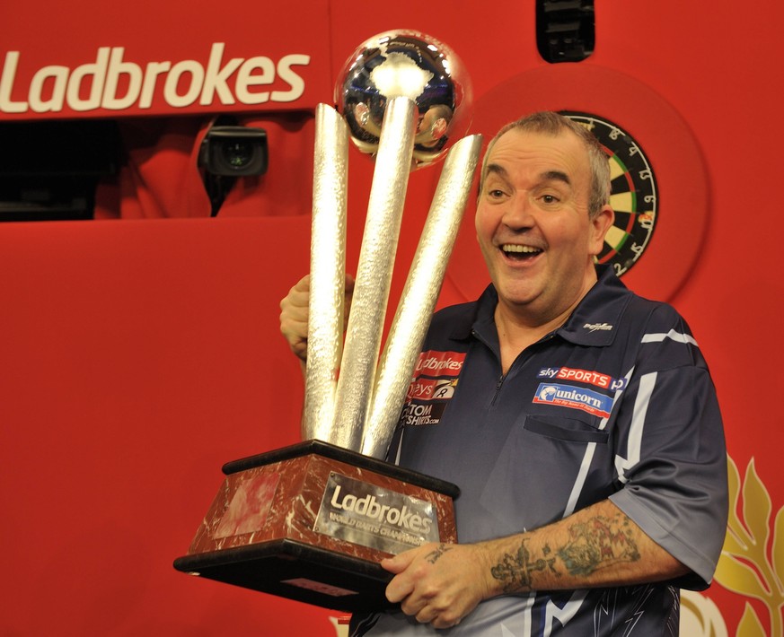 01.01.2013 London, England. Phil Taylor ENG becomes the 2013 Champion. Taking the 3;200,000 Pounds first prize and first player to lift the Sid Waddell Trophy. The Ladbrokes World Darts Championships  ...