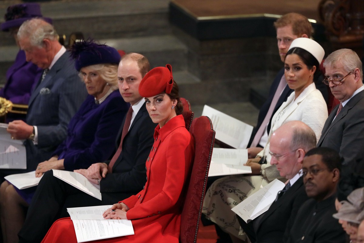 FILE - In this Monday, March 11, 2019 file photo, Britain&#039;s Kate, Duchess of Cambridge, foreground centre, sits with Prince William, Camilla, the Duchess of Cornwall and Prince Charles, front row ...