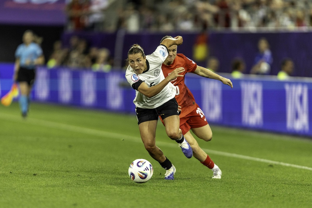 ST GALLEN, SWITZERLAND - JULY 4: Carlotta Wamser of Germany L) battles for the ball with Kayla Adamek of Poland R) during the UEFA Womens EURO 2025 Group C match between Germany and Poland at Arena St ...