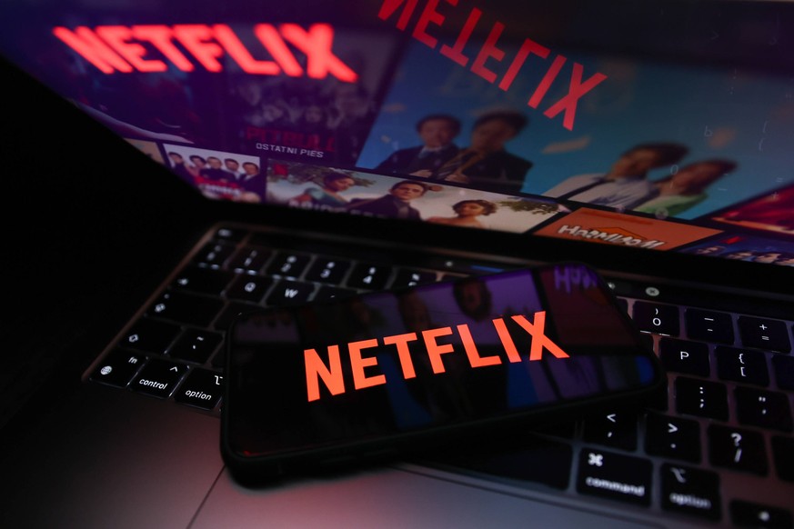 Netflix And Microsoft Photo Illustrations Netflix logo displayed on a phone screen and Netflix website displayed on a laptop screen are seen in this illustration photo taken in Krakow, Poland on July  ...