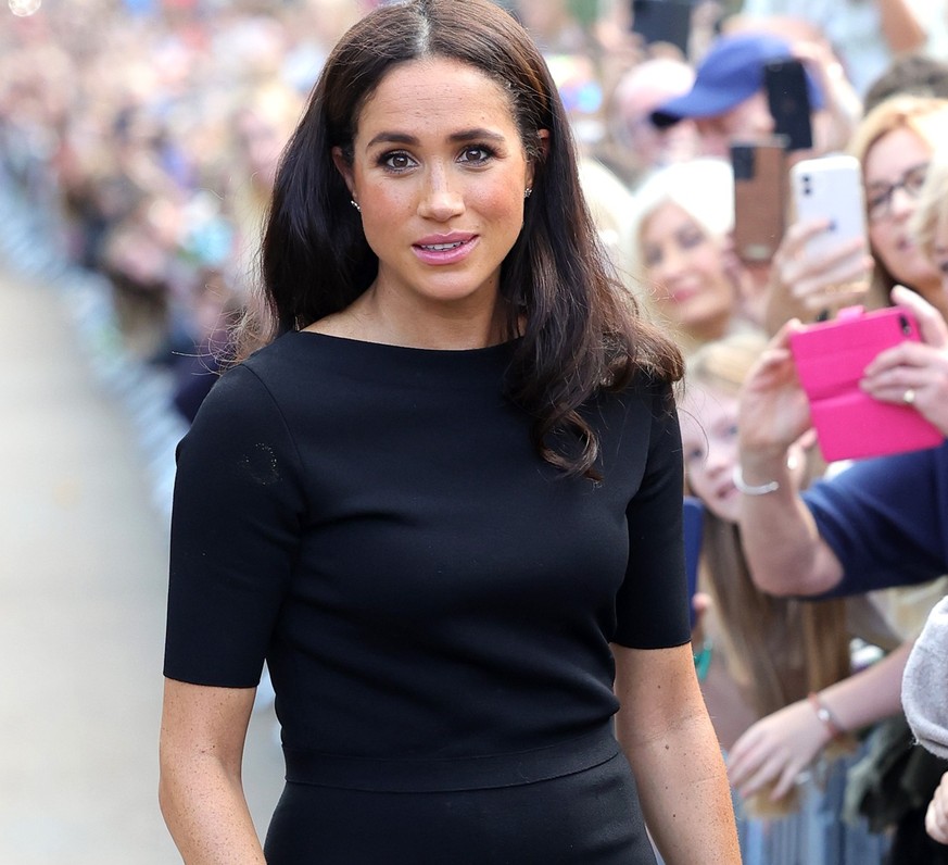 WINDSOR, ENGLAND - SEPTEMBER 10: Meghan, Duchess of Sussex meets members of the public on the long Walk at Windsor Castle after viewing flowers and tributes to HM Queen Elizabeth on September 10, 2022 ...