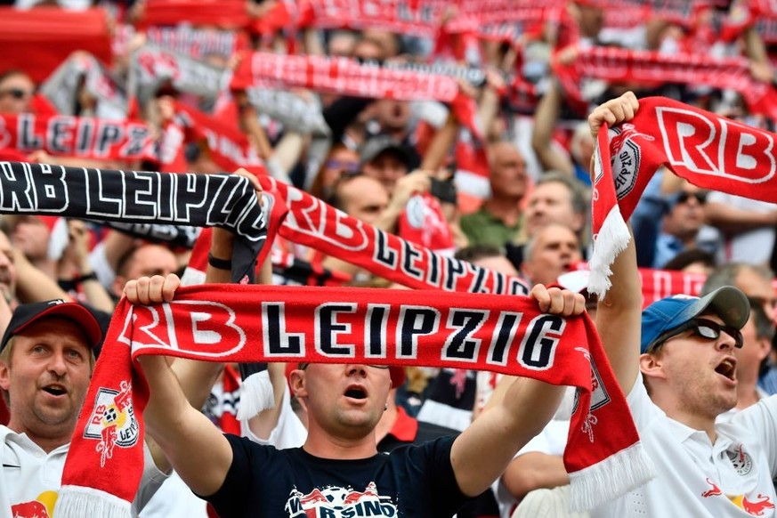 Leipzig fans display their scarves prior to the German first division Bundesliga football match between RB Leipzig and FC Bayern Munich on May 13, 2017 in Leipzig, eastern Germany. / AFP PHOTO / John  ...