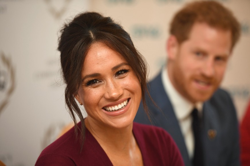 WINDSOR, UNITED KINGDOM - OCTOBER 25: Meghan, Duchess of Sussex and Prince Harry, Duke of Sussex attend a roundtable discussion on gender equality with The Queens Commonwealth Trust (QCT) and One Youn ...