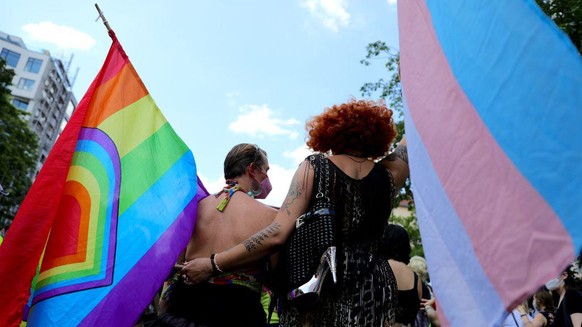 BERLIN, GERMANY - JUNE 26: Participants in the Queerschutz Now! (Queer Protection Now!) embrace each other as they march in commemoration and celebration of Christopher Street Day on June 26, 2021 in  ...