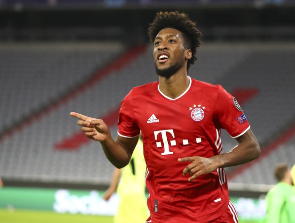 Bayern Munich&#039;s Kingsley Coman celebrates after scoring his team&#039;s fourth goal during the Champions League Group A soccer match between Bayern Munich and Atletico Madrid at the Allianz Arena ...