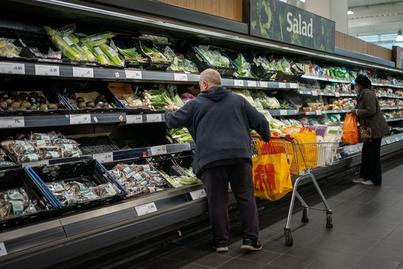 Groceries price rises. File photo dated 15/10/21 of shoppers in the fruit and vegetables section of a branch of Sainsbury&#039;s in south London. The cost of groceries is now 5.2% higher than it was a ...