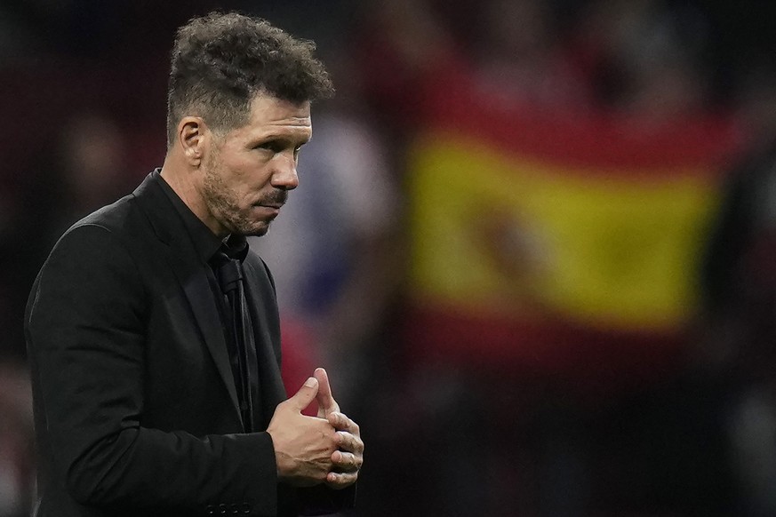 Atletico Madrid&#039;s head coach Diego Simeone walks after the group B Champions League soccer match between Atletico Madrid and Bayer 04 Leverkusen at the Civitas Metropolitano stadium in Madrid, Sp ...