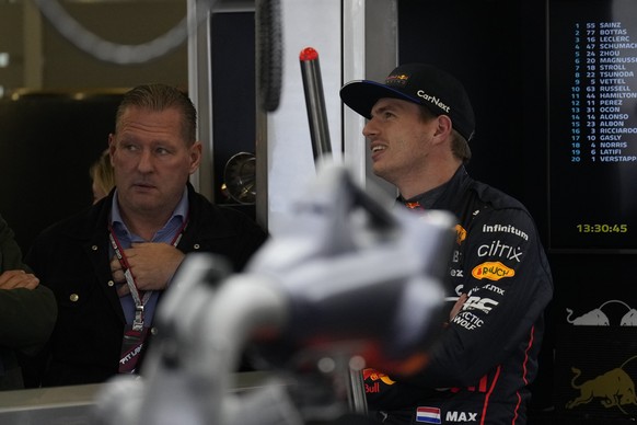 Red Bull driver Max Verstappen of the Netherlands, right, speaks with his father Jos Verstappen during the first free practice at the Silverstone circuit, in Silverstone, England, Friday, July 1, 2022 ...