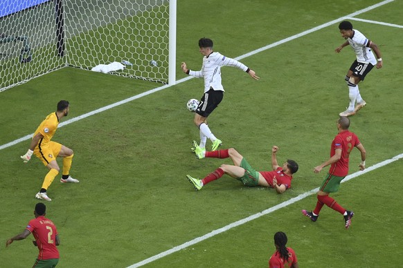 Germany&#039;s Kai Havertz, center top, scores his side&#039;s third goal during the Euro 2020 soccer championship group F match between Portugal and Germany at the football arena stadium in Munich, S ...