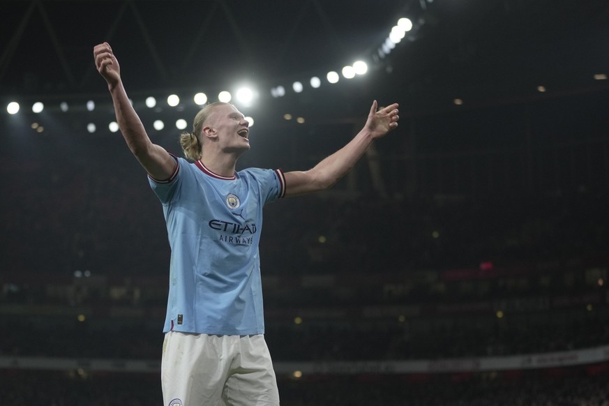 Manchester City&#039;s Erling Haaland celebrates after scoring his side&#039;s third goal during the English Premier League soccer match between Arsenal and Manchester City at the Emirates stadium in  ...