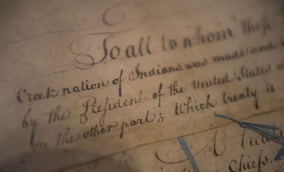 FILE - This March 16, 2015, file photo, shows a detail of the 1790 Treaty of the Muscogee (Creek) Nations and the United States non display at the Smithsonian's National Museum of the American Indian  ...