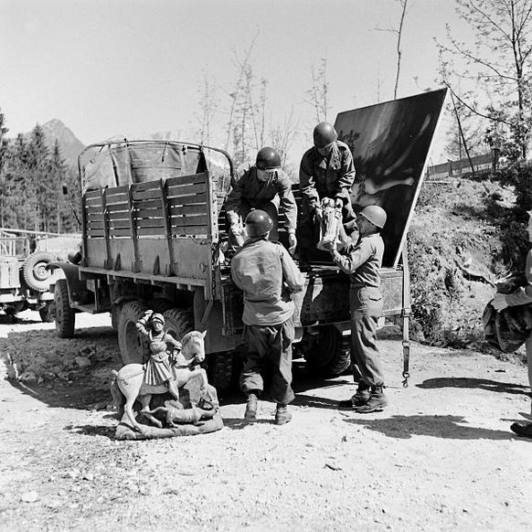 American soldiers load some of the art collection looted by the Nazis and Hermann Goering into a truck, near Berchtesgaden, Germany, 1945. (Photo by William Vandivert/The LIFE Images Collection via Ge ...