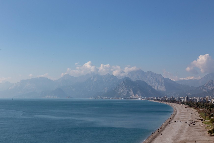 Antalya Daily Life Mediterranean Sea beach and Western Taurus peaks are seen from a coast of Antalya, a tourist resort in southern region of the Republic of Turkiye on February 18, 2024. Antalya is on ...