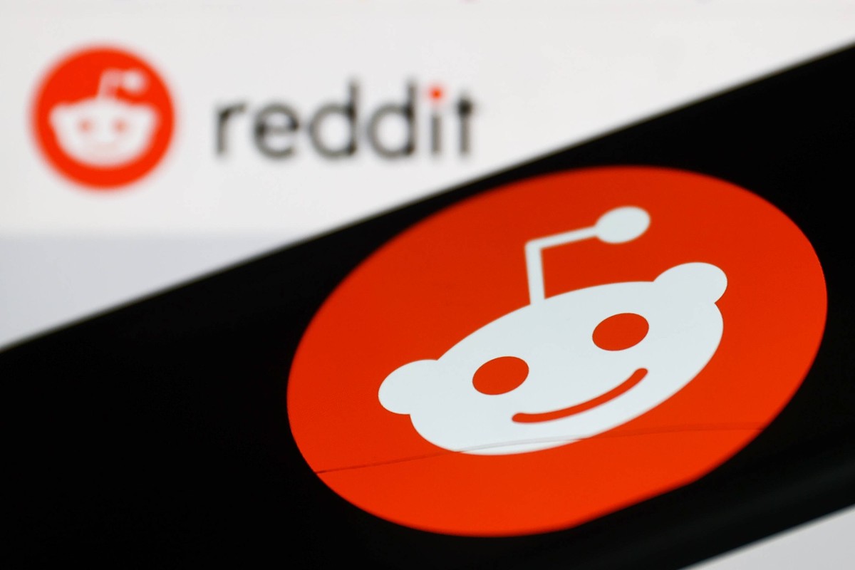 Twitter Alternatives Photo Illustrations Reddit logo displayed on a phone screen and Reddit website logo displayed on a screen in the background are seen in this illustration photo taken in Krakow, Po ...
