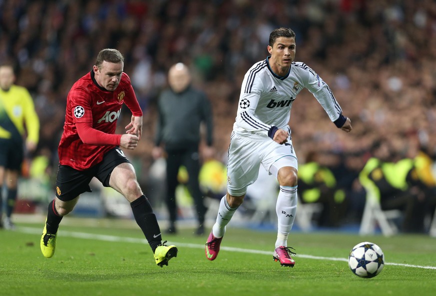 13th February 2013 - UEFA Champions League - Last 16 (1st Leg) - Real Madrid vs. Manchester United - Cristiano Ronaldo of Madrid battles with Wayne Rooney of Man Utd - Photo: Simon Stacpoole / Offside ...