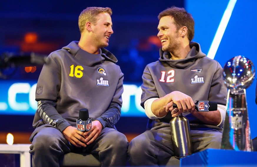 January 28, 2019 - Atlanta, Georgia, U.S - Los Angeles Rams quarterback Jared Goff (16) and New England Patriots quarterback Tom Brady (12) speak to the media with the Vince Lombardi Trophy during Sup ...