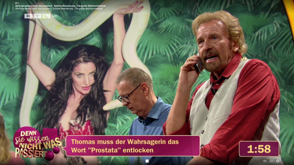 Thomas Gottschalk y Gunther Gausch hablan por teléfono con la adivina Johanna (con una serpiente).