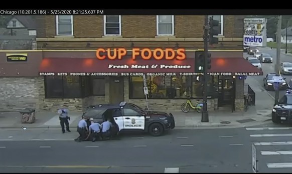 FILE - In this image from surveillance video, Minneapolis police officers from left, Tou Thao, Derek Chauvin, J. Alexander Kueng, and Thomas Lane attempt to take George Floyd into custody in Minneapol ...
