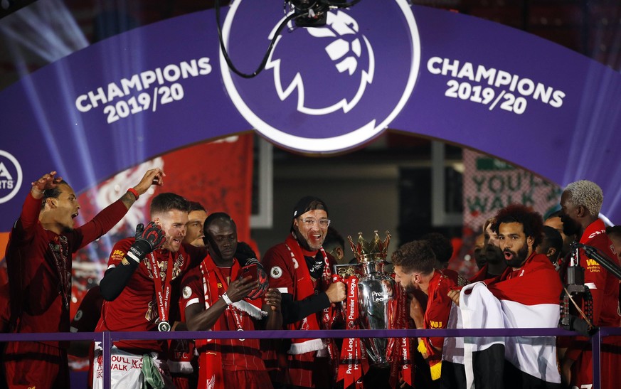 Liverpool v Chelsea - Premier League - Anfield Liverpool manager Jurgen Klopp with the trophy as the team celebrate winning the league after the Premier League match at Anfield, Liverpool. EDITORIAL U ...